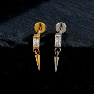Dangle cartilage piercing with a spike titanium labret stud