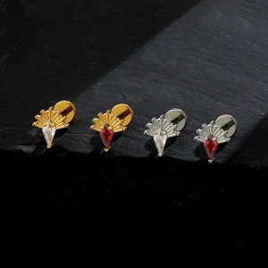 Red nose piercing with a kite-shaped stone available in black and clear