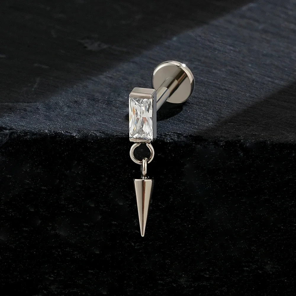 Dangle cartilage piercing with a spike titanium labret stud - Image 3