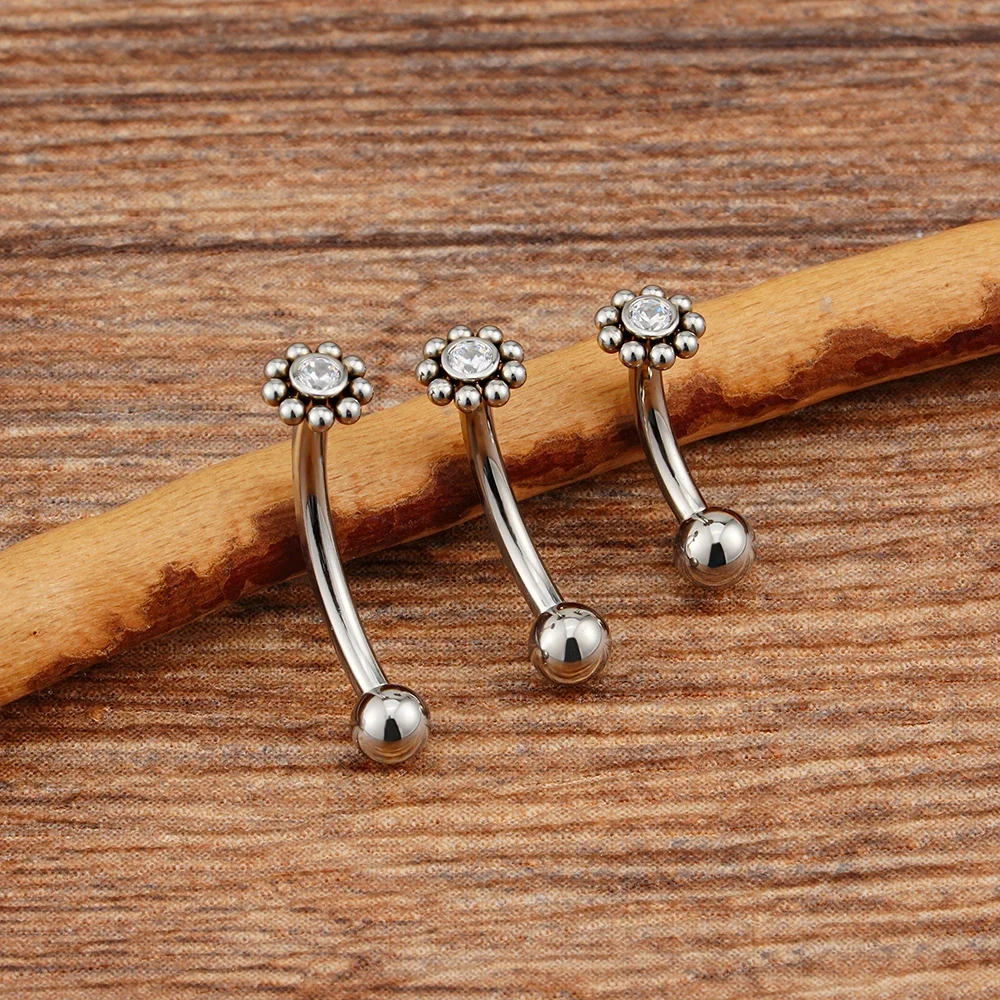 Anti-tragus ear piercing with a clear cz stone and dots in a flower shape short curved barbell - Image 3