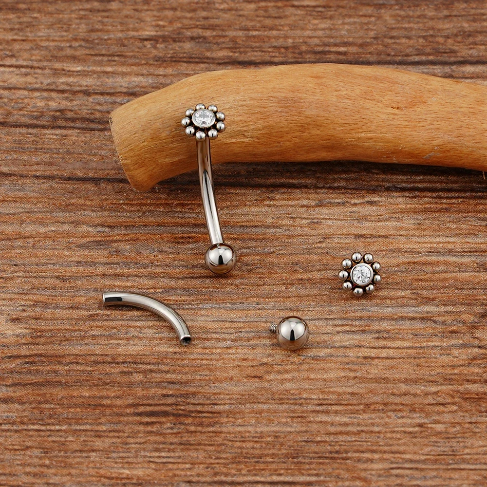 Anti-tragus ear piercing with a clear cz stone and dots in a flower shape short curved barbell - Image 5